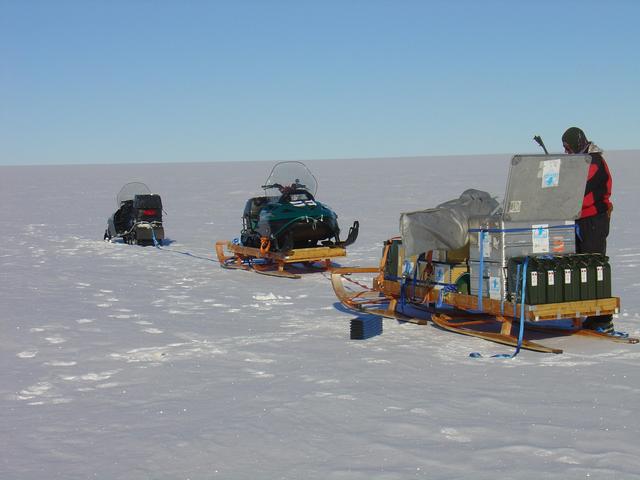 Snowcat caravan and Janne preparing tea