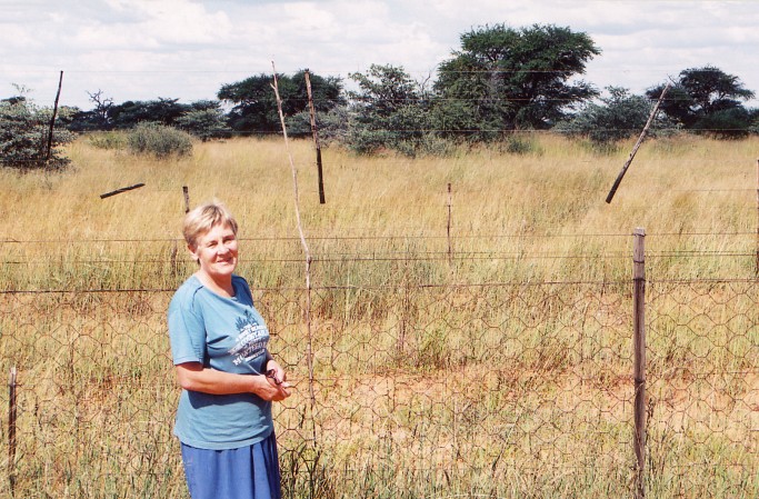 Maxie Steenkamp next to the boarder fence with the camera facing east
