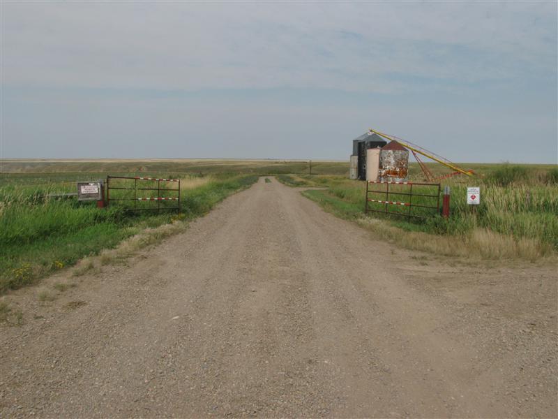 The entrance gate to the confluence area.  The sign on the left says "Private Property. No Trespassing"