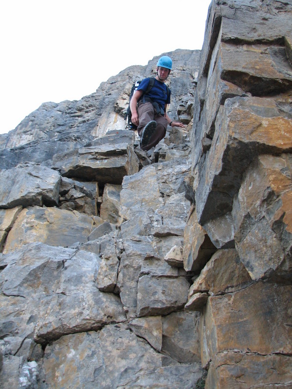 Brendan downclimbing one of the more dangerous gullies.