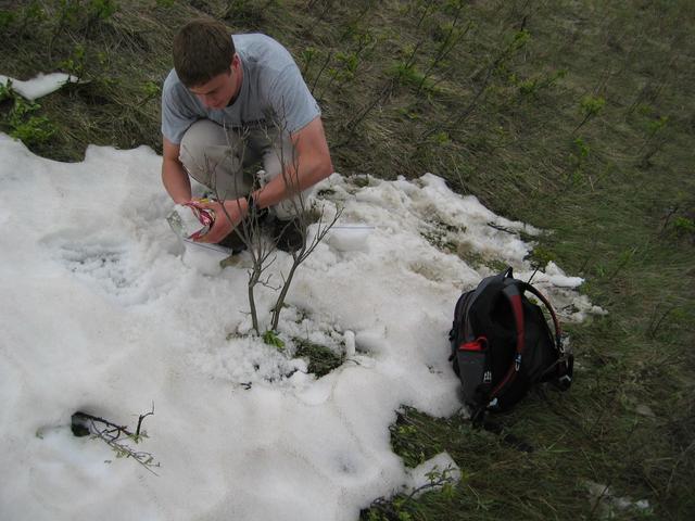 Robbie Gathering Snow to Melt for Cooking Water