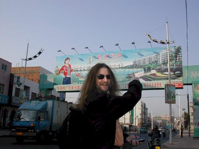Targ pointing to the Billboard advertising the Confluence Point Development