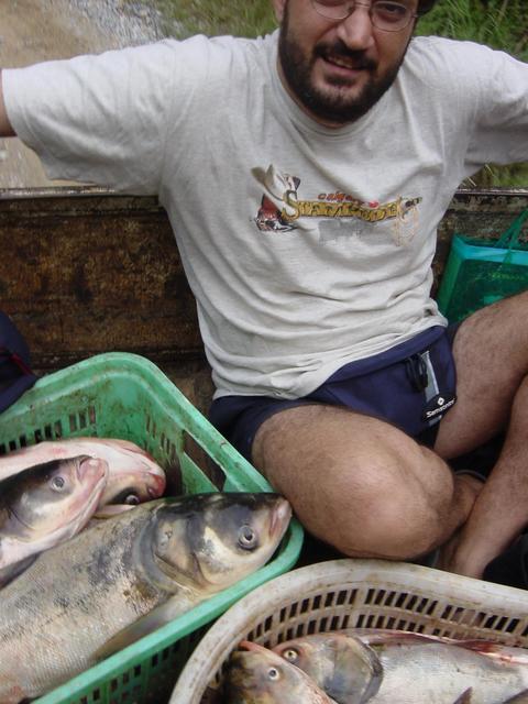 Tony wedged into back of truck carrying fish to market in Ansha (Peaceful Sand)