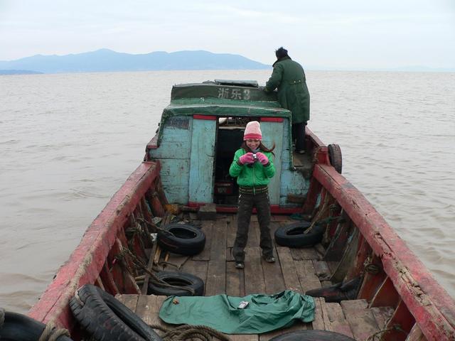 Liu Zifeng on the old wooden boat we chartered