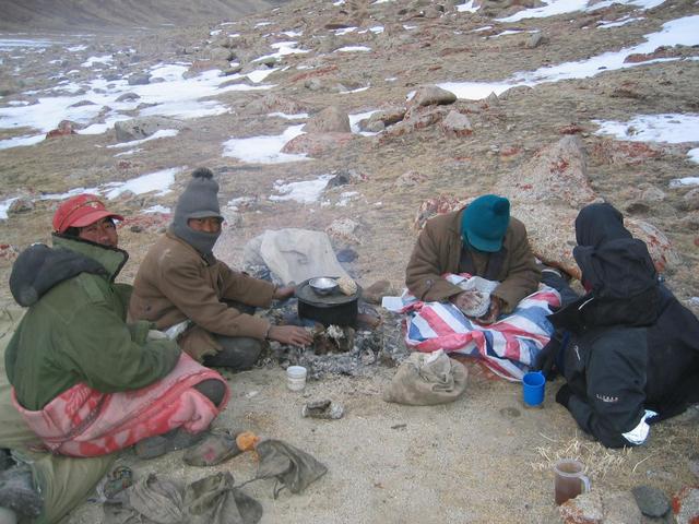 Buju, Sola, Taishi, Robert (left to right) shivering and making tsampa at U-valley cold campsite.