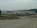 #3: Jiāngsū Zhōnghuì Metal Manufacturing Company Limited on the southeast corner of the intersection near the confluence