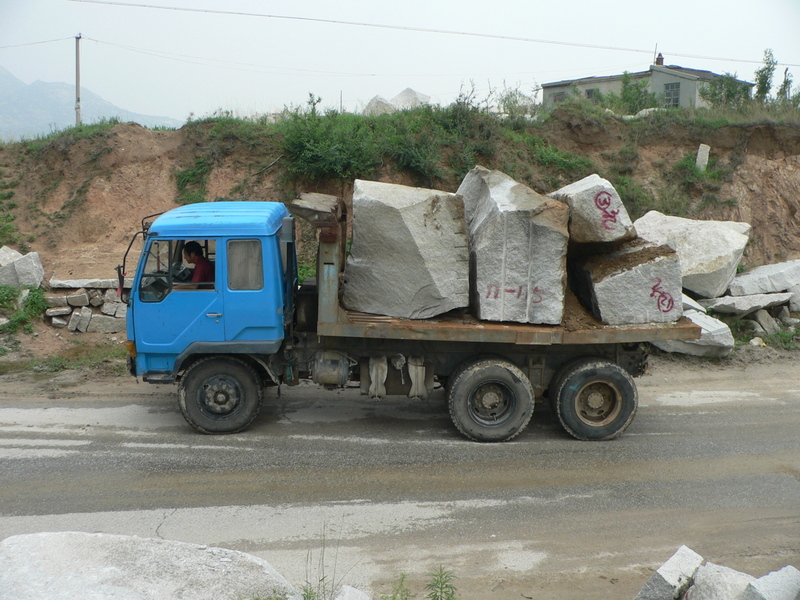 Truck carrying large chunks of rock