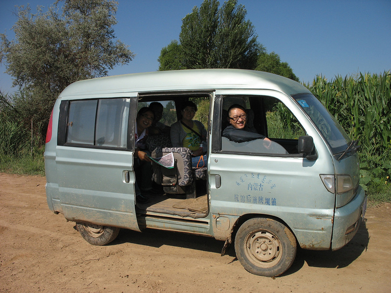 Team members in mini-van which we rented from a local farmer