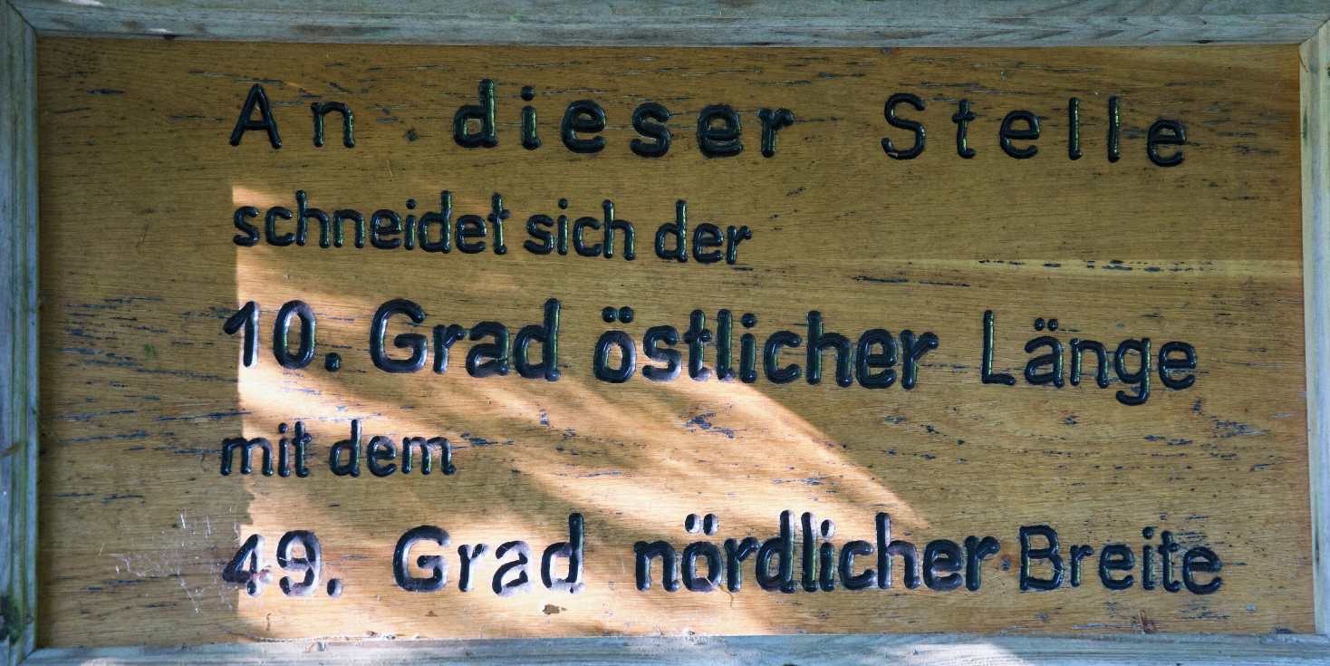 The sign (about 100m South of the WGS84 Degree Confluence Point) that notes the point, in a different datum
