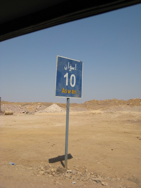 Road sign showing the distance back to Aswān