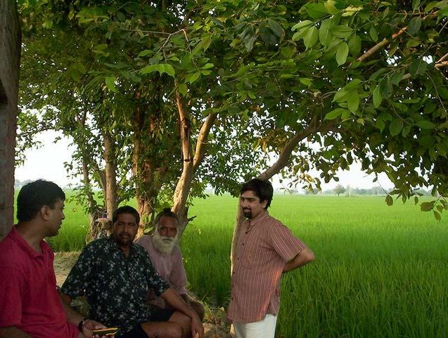 With villagers at farm