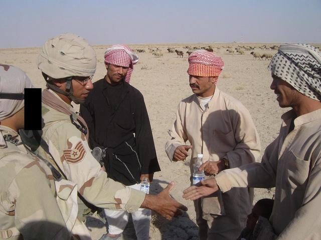 Meeting the locals (L to R, Karim & SSgt Samuel F. & local Iraqis)