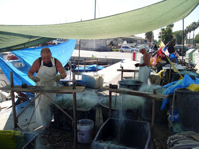 fishermen fixing their nets