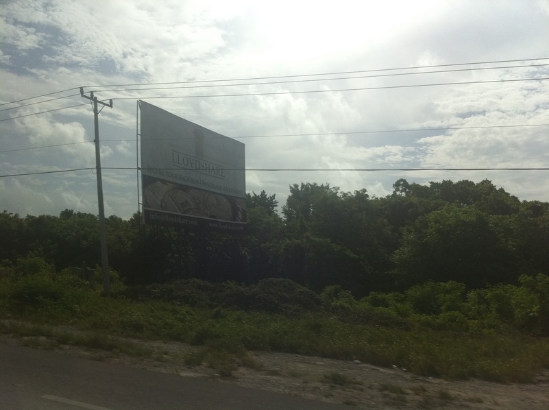 One of the many billboards on the way to the Cancun airport near the confluence.