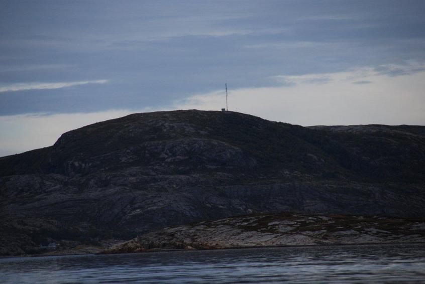 To the north Stokkøya (Log Island) with the local TV mast
