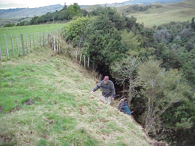 Murray Ellis and Anne Olsen climbing the gully on the way out of the confluence meadow.