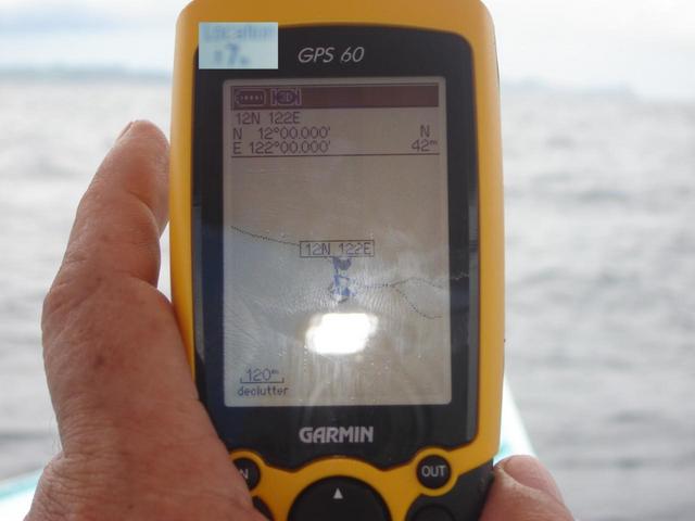 GPS showing 42m distance from datum, with blurry inset showing plus/minus 7m positional error