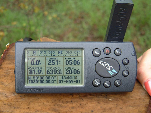 Debra holding the GPS reading N50°00'00.0" E020°00'00.0"