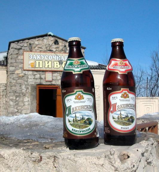 Inscription on label - “Lakinsk Classic Beer”, in the background - typical Russian provincial beer&snackbar