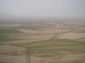 #7: General view to the NE, with Kalaba (the nearest large town). The Confluence lies in the wheat fields beyond the two large buildings in the centre right.