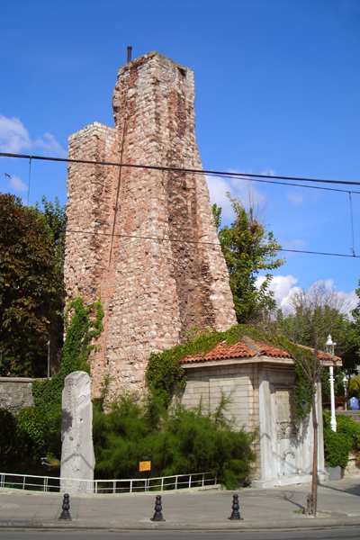 Ruins of triumphal arch Miliarium Aureum (The Golden Mile) and Turkish water-tower