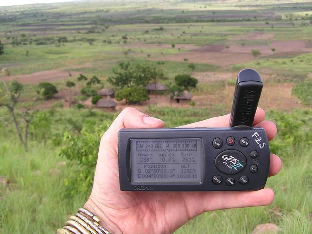 The trusty GPS with the coordinates and Mzee Matinde's house in the background.