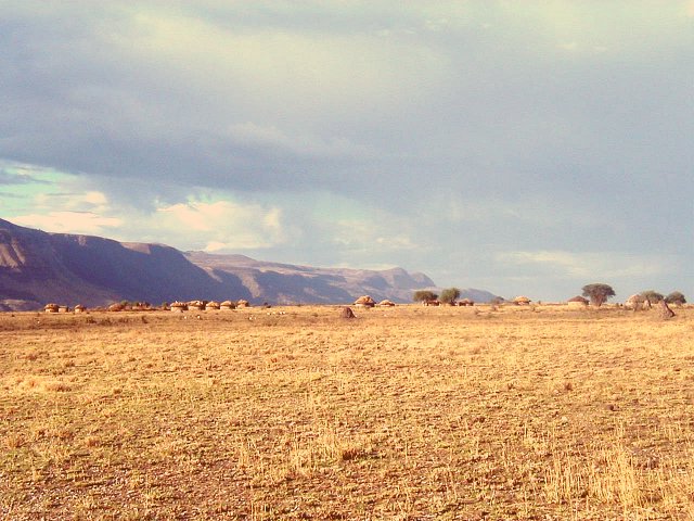 Looking North along the Escarpment with a Maasai village in the foreground