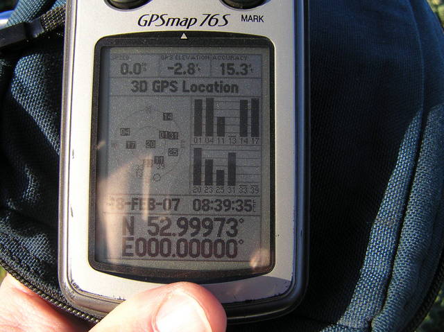 On the Prime Meridian:  GPS receiver at the edge of the field, near the confluence.