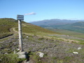#9: Signpost to Mount Keen and brilliant blue sky.