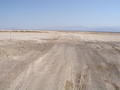 #10: A mile north of 36N 116W, the nearby road crosses a dry lakebed.