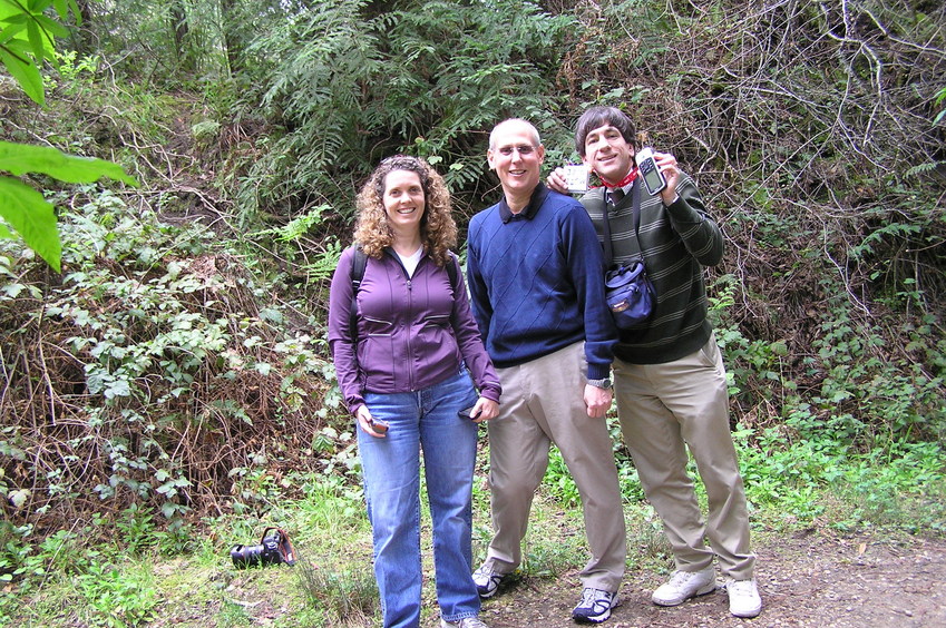 Lorrie Conklin, Greg Conklin, and Joseph Kerski at the confluence point.