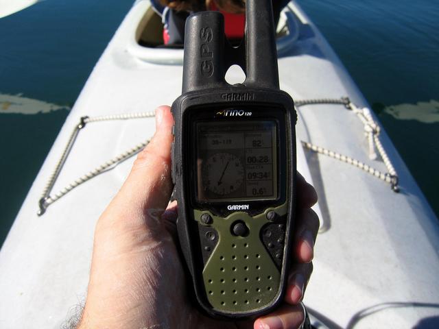 RINO GPS information. This picture shows me drifting 82 feet beyond the point. Notice how still and mirror-like the water is and the white film all over my hand. Since my RINO is waterproof, I was able to pour some fresh water over it to clean it before t