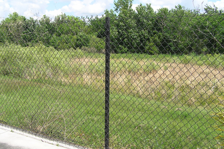 View of the fence and the confluence beyond, looking northwest.