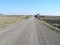 #9: View due south 6 meters east of the 93rd Meridian, down the nearest roadway to the confluence.