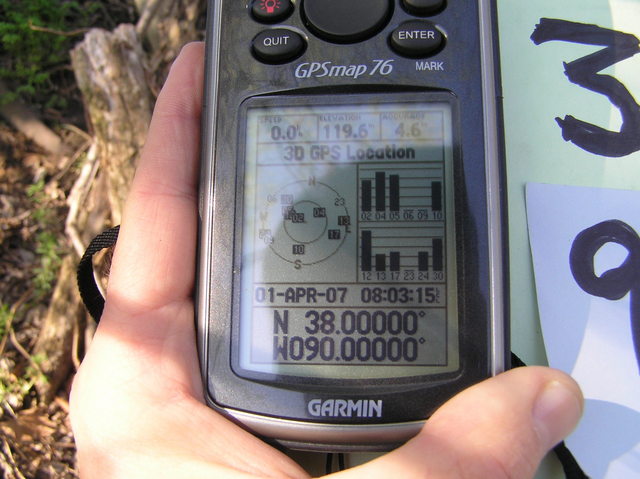 GPS reading at the confluence, a bit tricky to obtain under the trees.