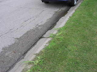 #1: The confluence point lies either on the street, or the grass verge