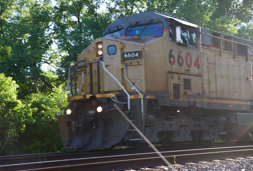 A freight train passes along the railroad tracks, just north of the point