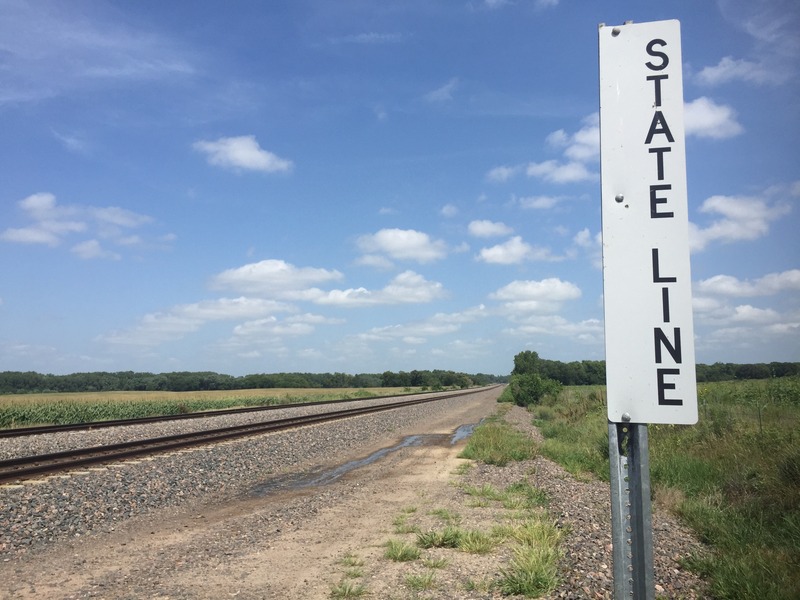State line sign on railroad track about 2000 meters northwest of the confluence.