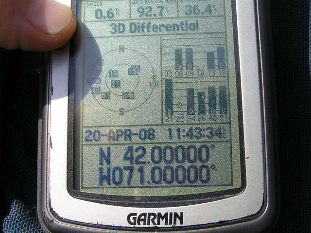 GPS reading at the confluence in the middle of the street.