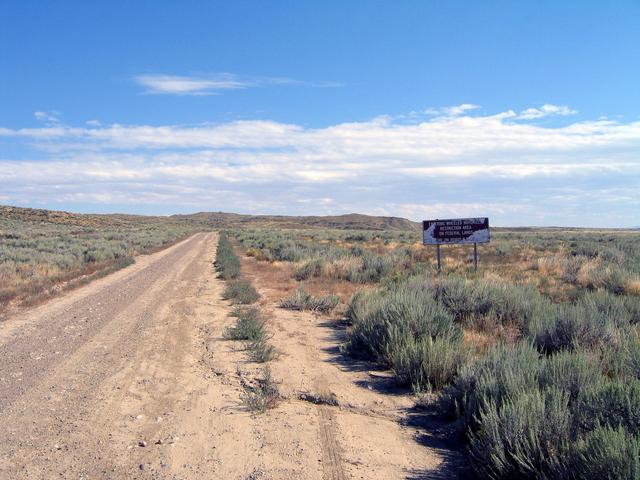 Sign at start of road to confluence