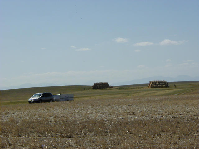 Looking west from higher ground about 20 meters away. Rocky Mountains appear faintly in the background. Van and trailer survived the off-road adventure.