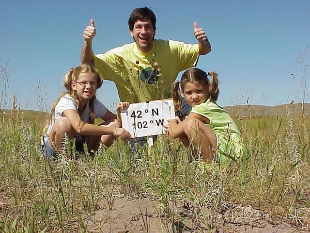 Emily, Joseph, and Lilia Kerski at the confluence site in the Nebraska sand hills.