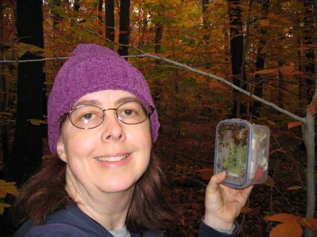 Lynn with the geocache located at the confluence