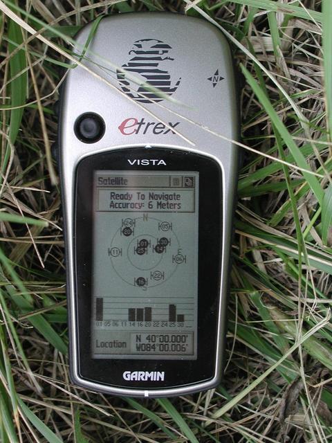 GPS on ground near confluence point (across a barbed-wire fence about 15 m east).