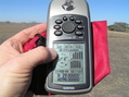 #6: GPS receiver at the confluence with a view of the horizon.