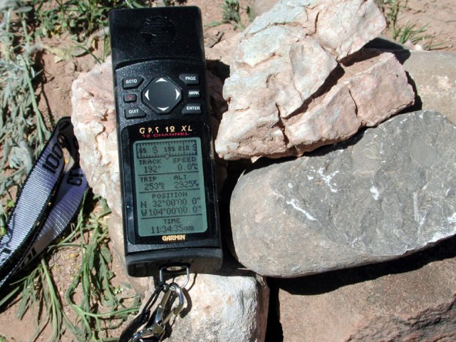 GPS sitting on the cairn constructed at the confluence