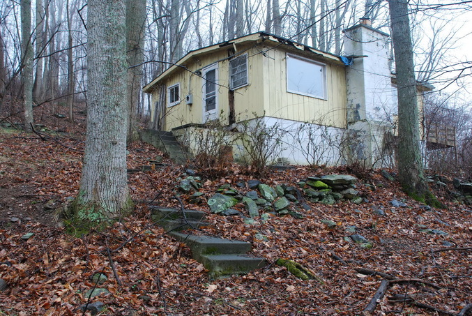 The abandoned house where the hunt started on foot