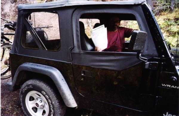 Ward in Jeep with map