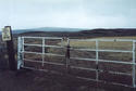 #6: First locked gate, looking south.  Confluence is 2.74 kilometers away.