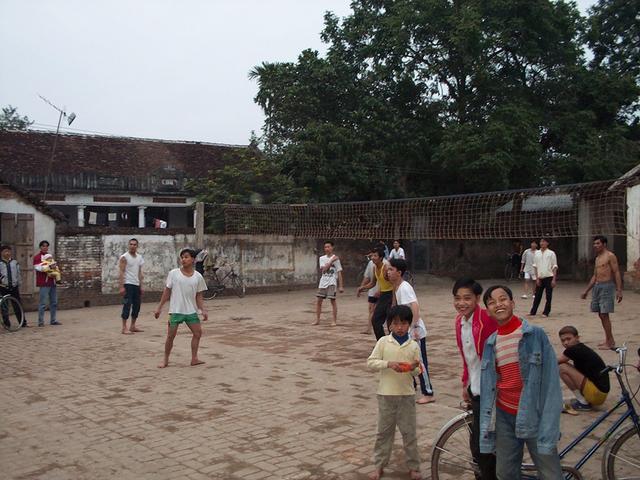 People of the village of Tan Nguy play volleyball